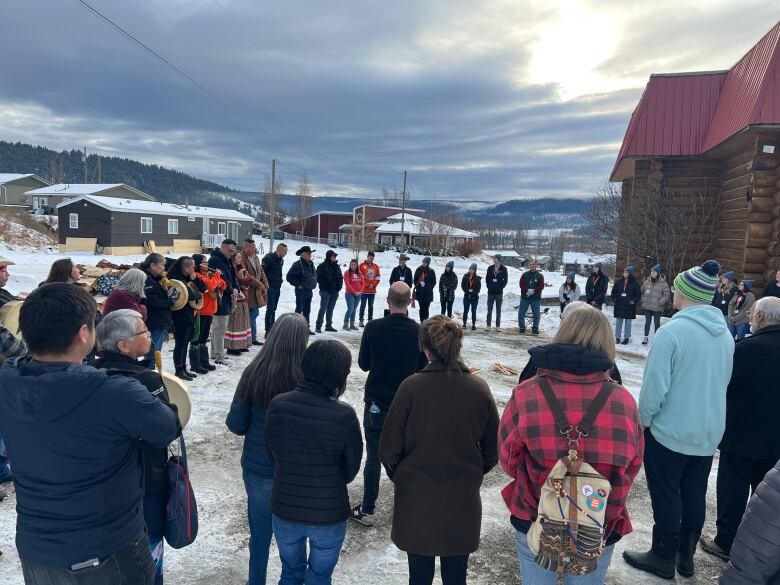 People gather around a sacred fire following the Williams Lake First Nation's announcement of Phase 2 findings.