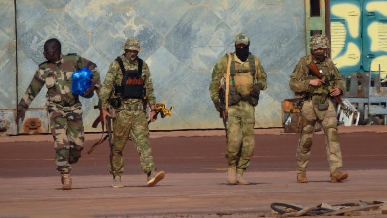 This undated photograph handed out by the French military shows three Russian mercenaries, right, in northern Mali. Russia's Wagner Group, a private military company led by Yevgeny Prigozhin, a rogue millionaire with longtime links to Russia's President Vladimir Putin, has played a key role in the fighting in Ukraine and also deployed its personnel to Syria, Central African Republic, Libya and Mali.