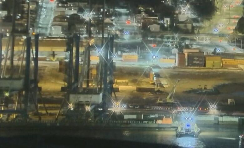 Boat with two cranes in the dark