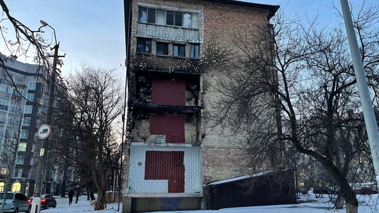 Part of an apartment building is missing after it was damaged in an airstrike.