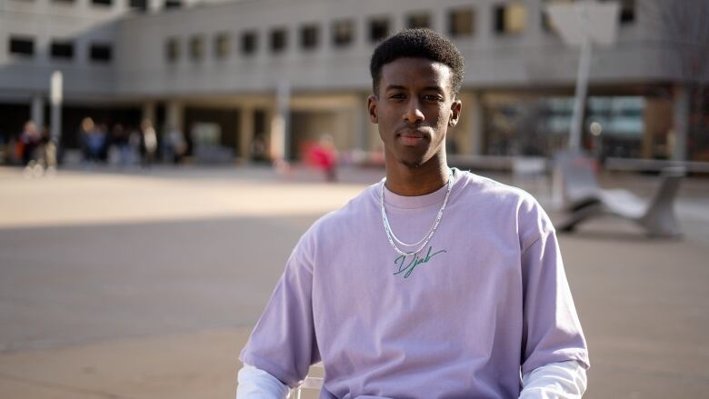 man in purple shirt