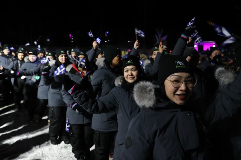 Athletes at the MacDonald Island Park in Fort McMurray, Alta., for the Arctic Winter Games opening ceremony.