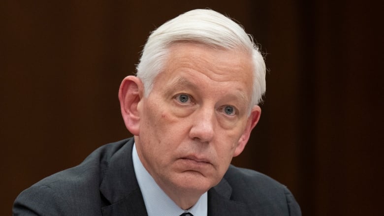 Dominic Barton waits to appear as a witness at the Standing Committee on Government Operations and Estimates, Wednesday, February 1, 2023 in Ottawa.