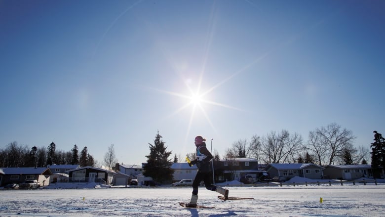 A person races in a snowshoe event.