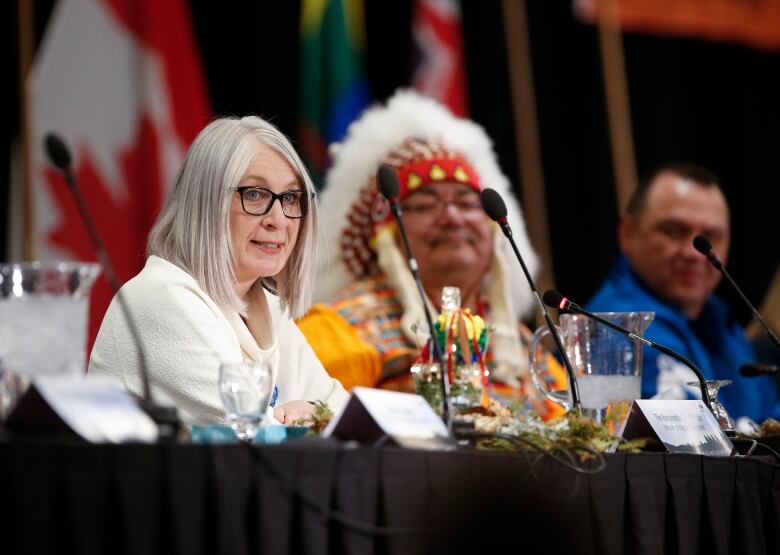 Peguis Chief Glenn Hudson listens in as Patty Hajdu, Minister of Indigenous Services Canada, speaks at an event where Peguis First Nation and Child and Family Services (CFS) along with the federal and Manitoba governments announce and sign the Peguis First Nation Honouring our Children, Families and Nation Act Coordination Agreement in Winnipeg, Tuesday, January 31, 2023.  The governments of Canada and Manitoba joined Peguis Chief Glenn Hudson and Peguis CFS for this historic event. THE CANADIAN PRESS/John Woods