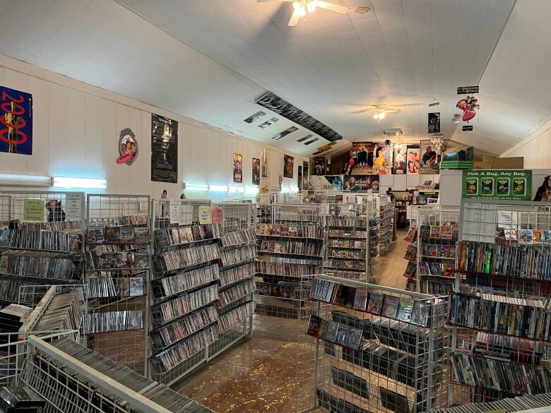 A large room is filled with thousands of movies on DVD and Blue-ray.