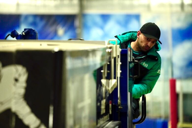 Man driving a Zamboni.