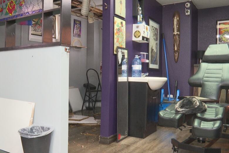 tattoo studio with ceiling tiles on floor 