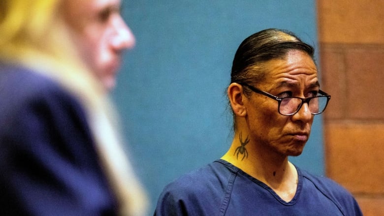 Nathan Chasing Horse is pictured in a courtroom looking somber. 