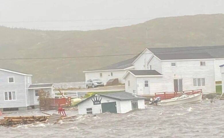 A collection of buildings partly submerged in water.