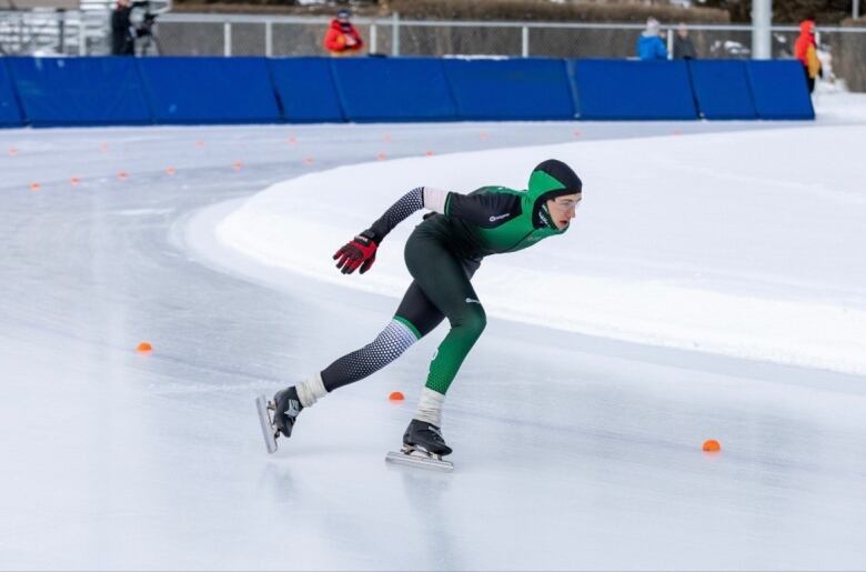 A speed skater on an outdoor oval 