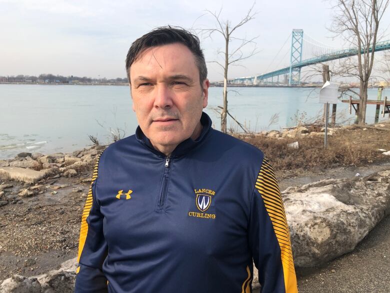 Mike McKay, the director of the Great Lakes Institute for Environmental Research at the University of Windsor stands next to the Detroit River.