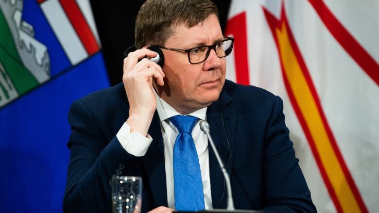 Saskatchewan Premier Scott Moe listening in during a press conference in Ottawa, on Tuesday. Moe said the premiers will meet to discuss the federal government's health-care spending plan with the provinces.