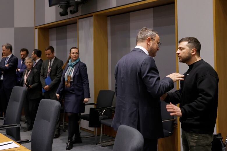 Luxembourg's Prime Minister Xavier Bettel, second right, speaks with Ukraine's President Volodymyr Zelenskyy during a meeting on the sidelines of an EU summit in Brussels on Thursday, Feb. 9, 2023. European Union leaders are meeting for an EU summit on Thursday to discuss Ukraine and migration.