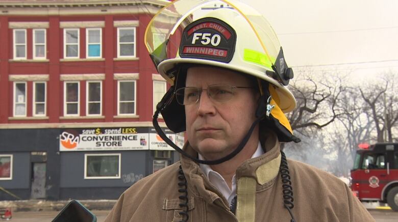 A firefighter speaks with the media.