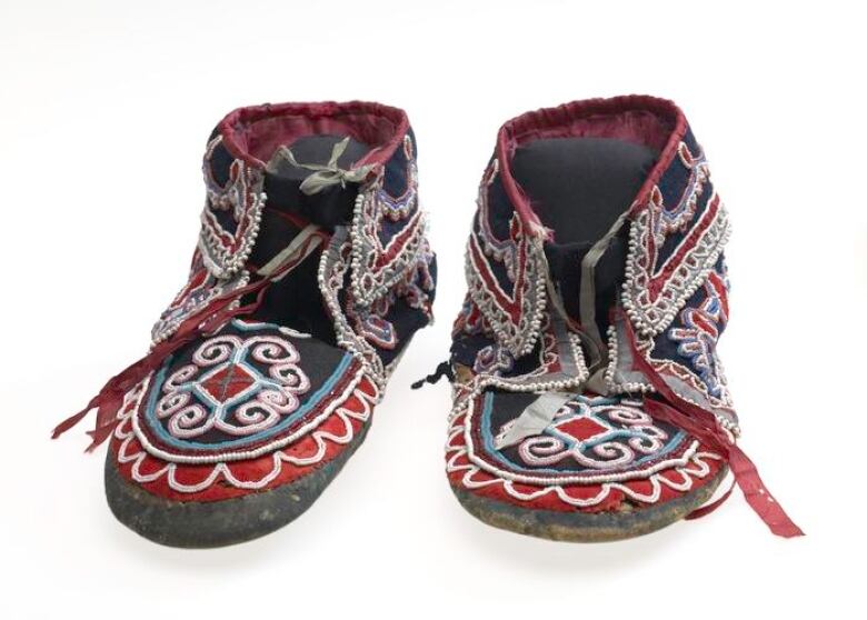 A pair of beaded mocassins.