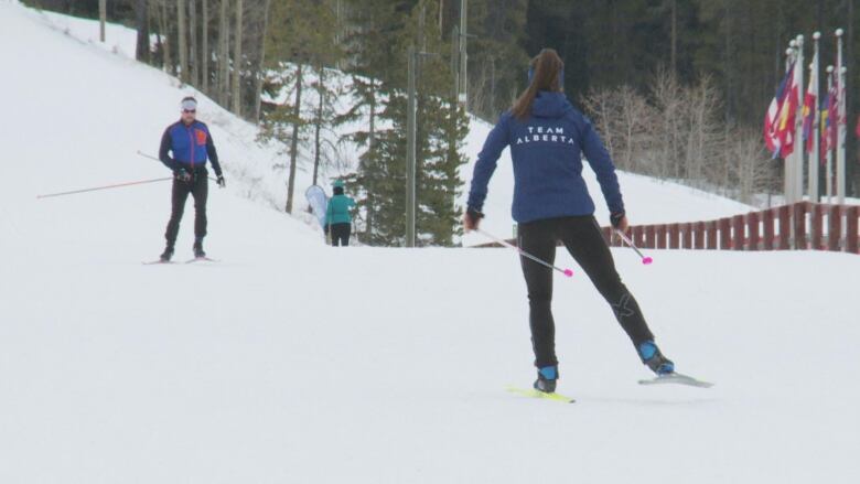 A woman skis across the snow at Canmore Nordic Ski Club.