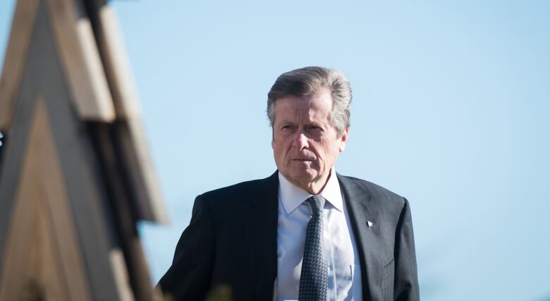 A photo of John Tory against a blue sky