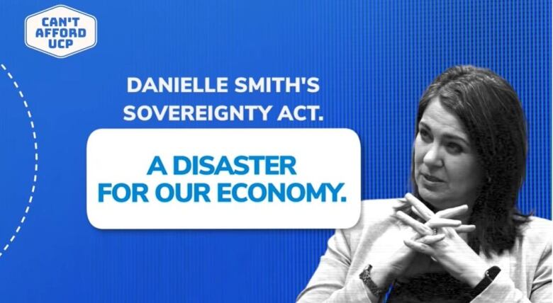 UCP leader Danielle Smith interlaces her fingers beneath her chin in a black-and-white photo used in an NDP attack ad that calls the Sovereignty Act a disaster for the economy.