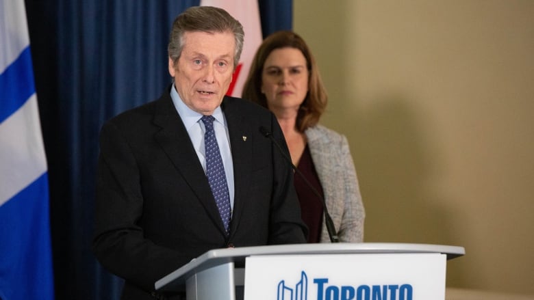 Deputy Mayor Jennifer McKelvie looks on as Toronto Mayor John Tory delivers his final statement as mayor on Feb. 17, 2023. Tory resigned from his position after he admitted he had an extramarital relationship with a former staffer.