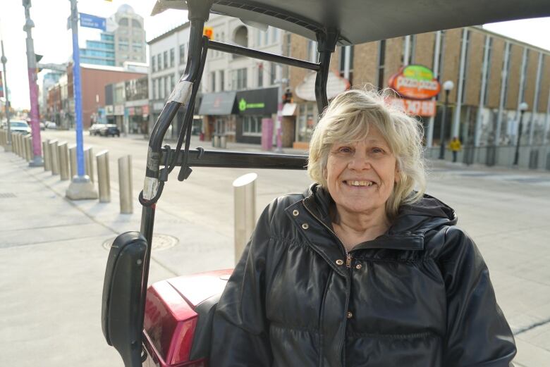 Jennifer Adams is sitting on her mobility chair in downtown Kitchener. 