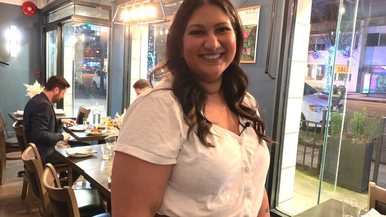 Pricilla Deo, co-owner of Folke restaurant in Vancouver, stands in her restaurant. 