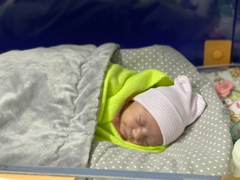 Bogdana, one of the Kherson hospital's infant patients, sleeps on the ward. She was born prematurely on Jan. 29, 2023.