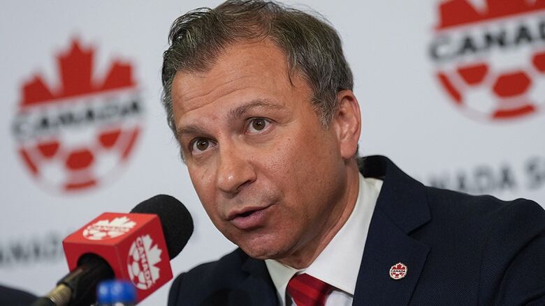 Canadian men's soccer executive addresses the media.