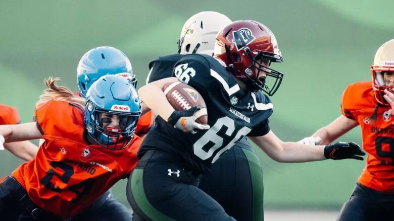 A player runs the ball during the 2022 Women's U18 Tackle National Championship