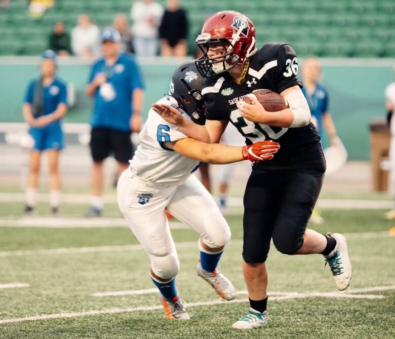 Dodging a tackle from the 2022 Women's U18 Tackle National Championship