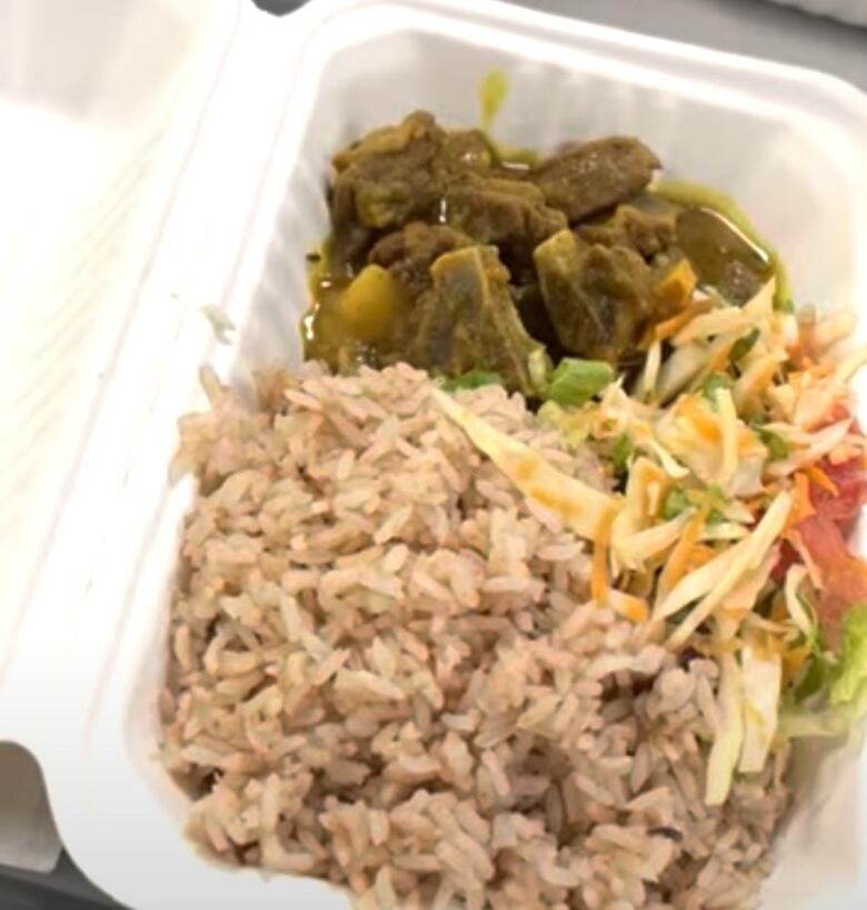 A photo of food in a takeout container.