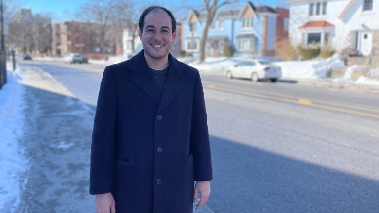 Man standing in street.