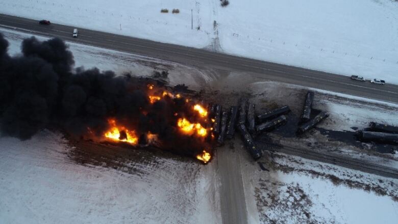 A number of tanker cars are on fire after a derailment near Guernsey, Sask. in 2020. 