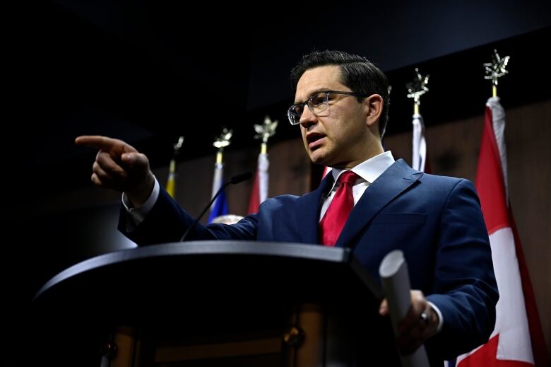 Conservative Leader Pierre Poilievre points to take a question from another journalist during a news conference on Parliament Hill in Ottawa, Monday, March 6, 2023.