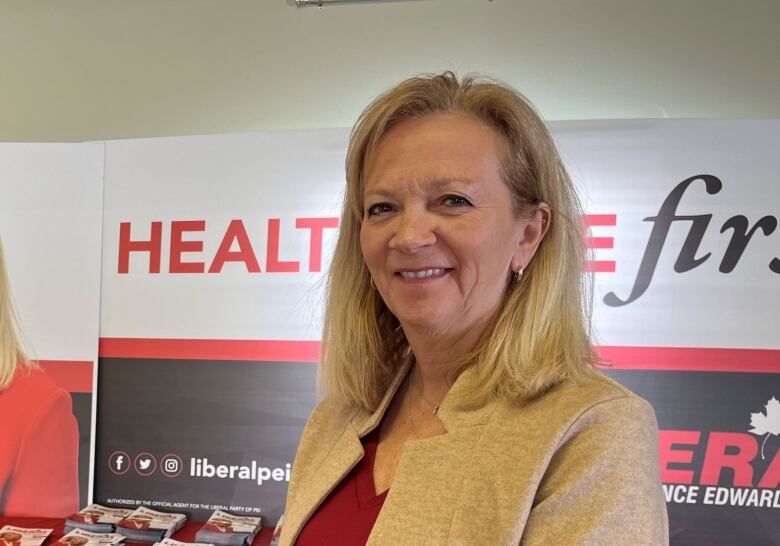 P.E.I. Liberal Leader Sharon Cameron with campaign sign.