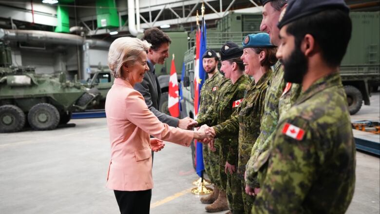 European Commission President Ursula von der Leyen and Prime Minister Justin Trudeau talk with members of the Canadian Armed Forces at CFB Kingston.