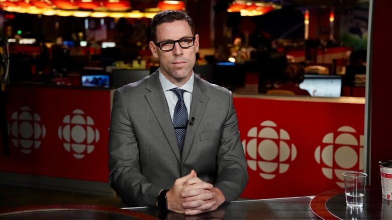 John Armit sits at the CBC Ottawa office