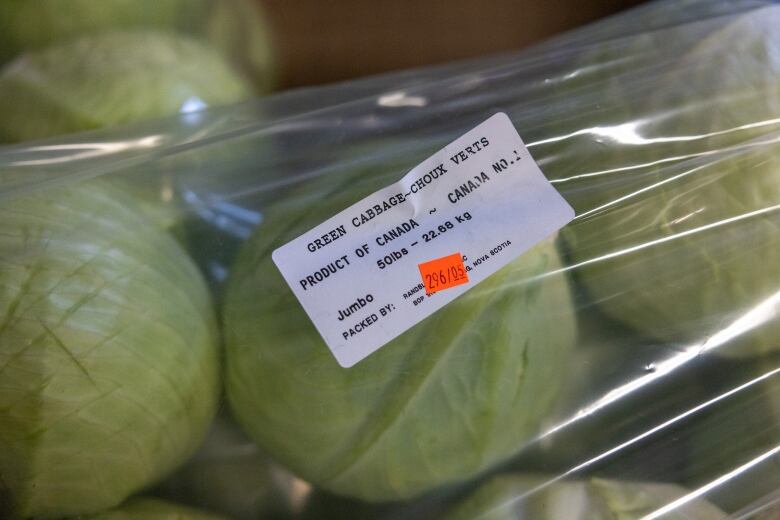 Cabbage wrapped in plastic.