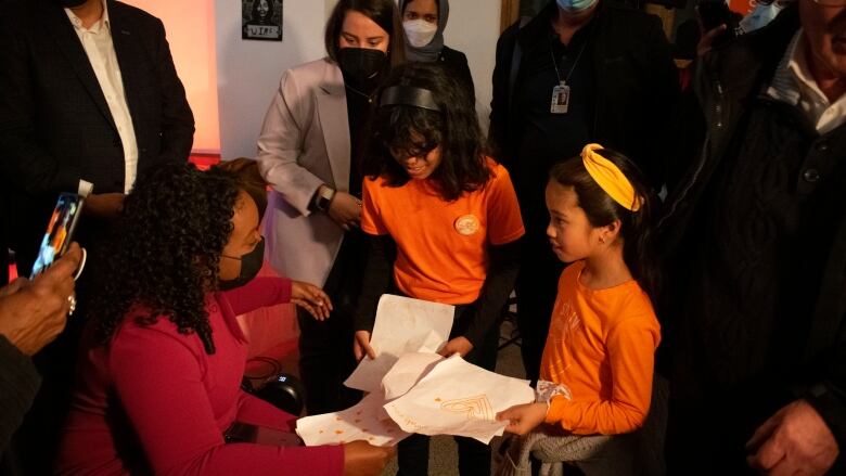 A woman and two young girls.