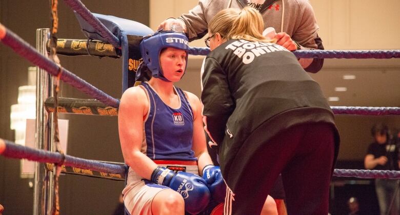 A boxer in her corner between rounds.