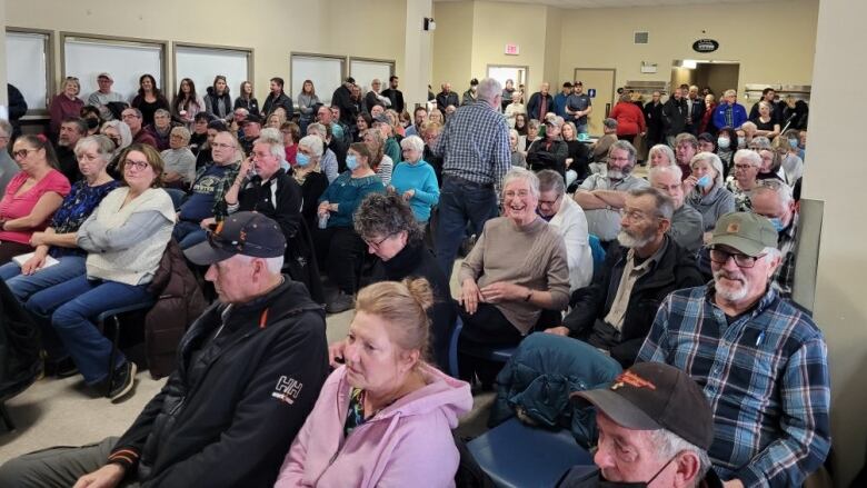 Some of the more than 200 people who filled Saturday's meeting to capacity at Cavendish Wellness Centre in Montague. Others, outside in the parking lot, attempted to watch a livestream of the meeting.