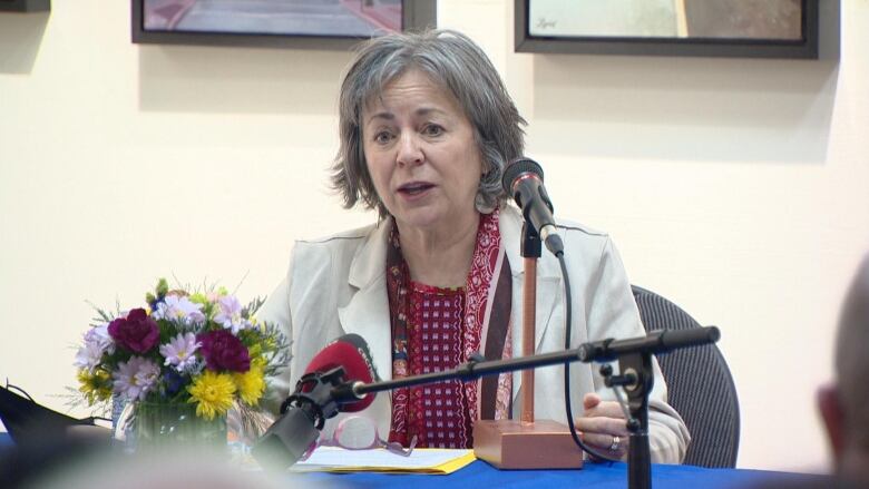 Woman speaking into mic