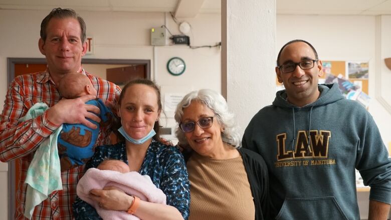 A group of people smile for a photo.