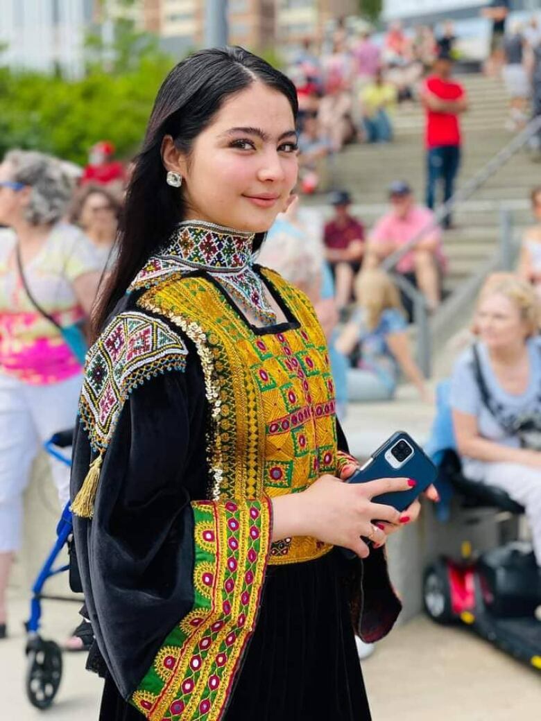 Farhang Nesar in a traditional Afghan outfit during a performance in Saskatoon.