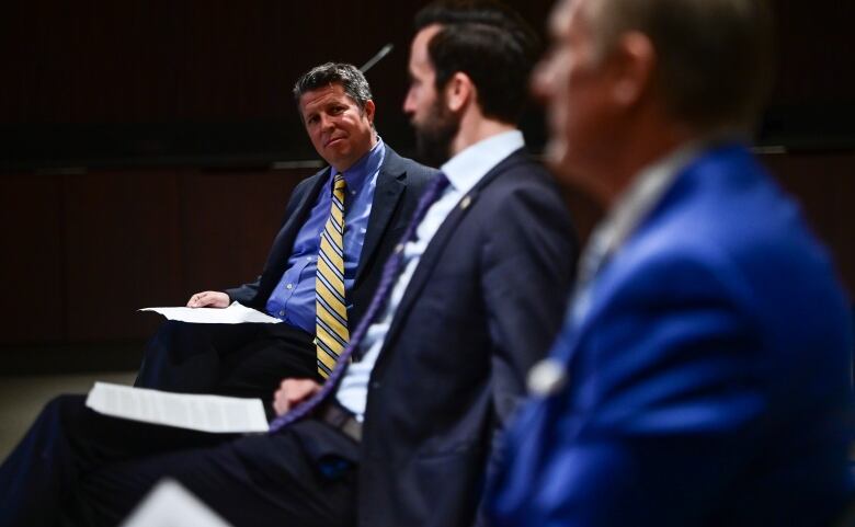 Pastor Michael Thiessen, left to right, Federal MP Derek Sloan (Hastings-Lennox & Addington) and Maxime Bernier (Leader of the People's Party of Canada) wait to hold a press conference on Parliament Hill in Ottawa on Thursday, April 15, 2021, to discuss there 