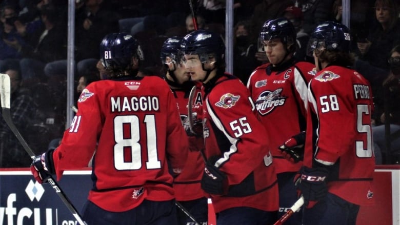 The Windsor Spitfires celebrate a goal.