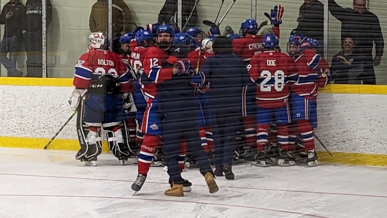 The Lakeshore Canadiens celebrate after scoring a 5-4 win over the Wheatley Omstead Sharks in a game that lasted 145 minutes 32 seconds.