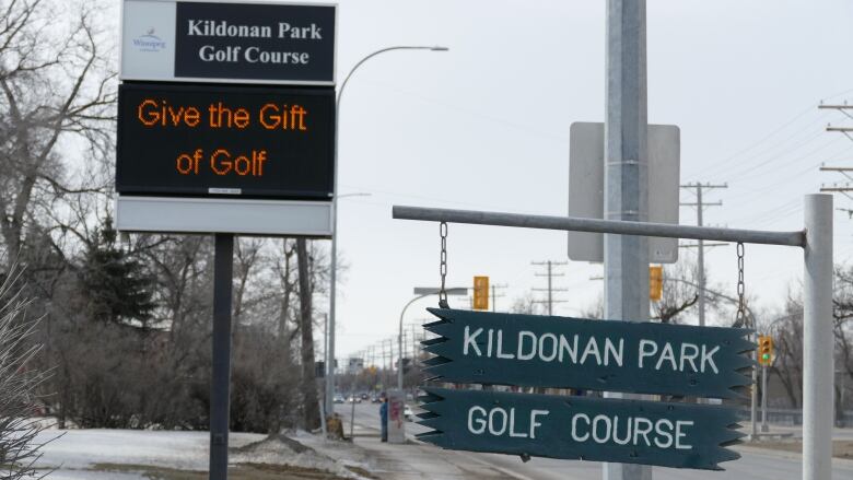 An electronic sign and a wooden sign outside Kildonan Park Golf Course, both bearing the name of the course.