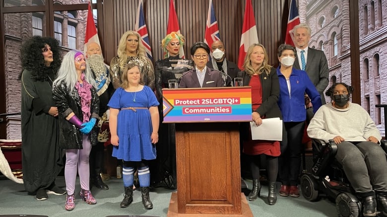 Drag performers and NDP MPPs speak at Queens Park on April 4, 2023.