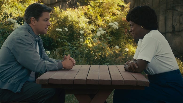 Matt Damon as Sonny Vaccaro and Viola Davis as Deloris Jordan in Air.  A man and woman sit a table facing each other. 